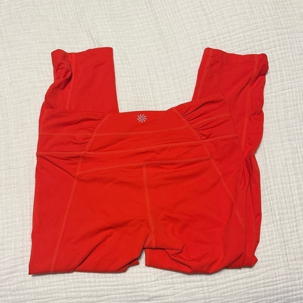 Orange Athleta Crop leggings size small.